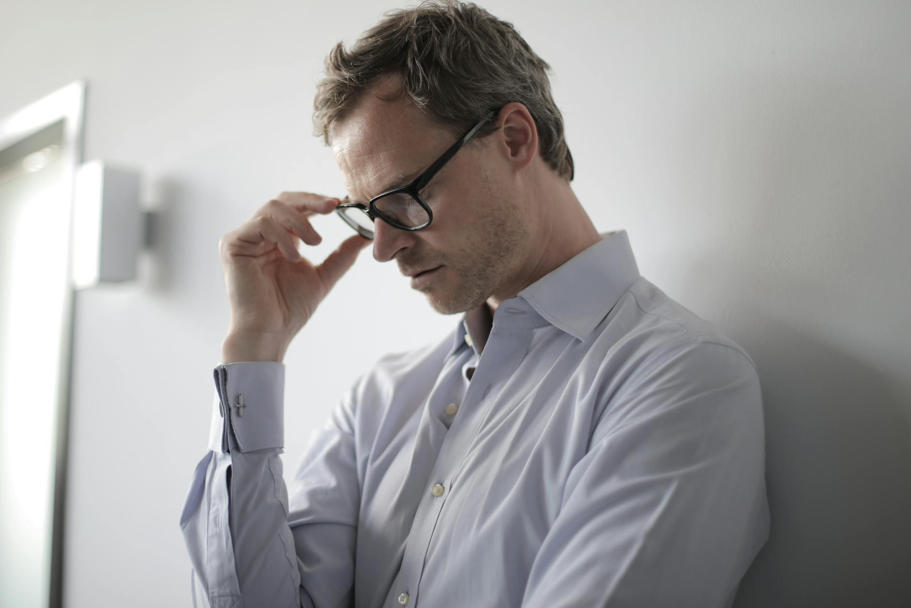 photo of man wearing black eyeglasses